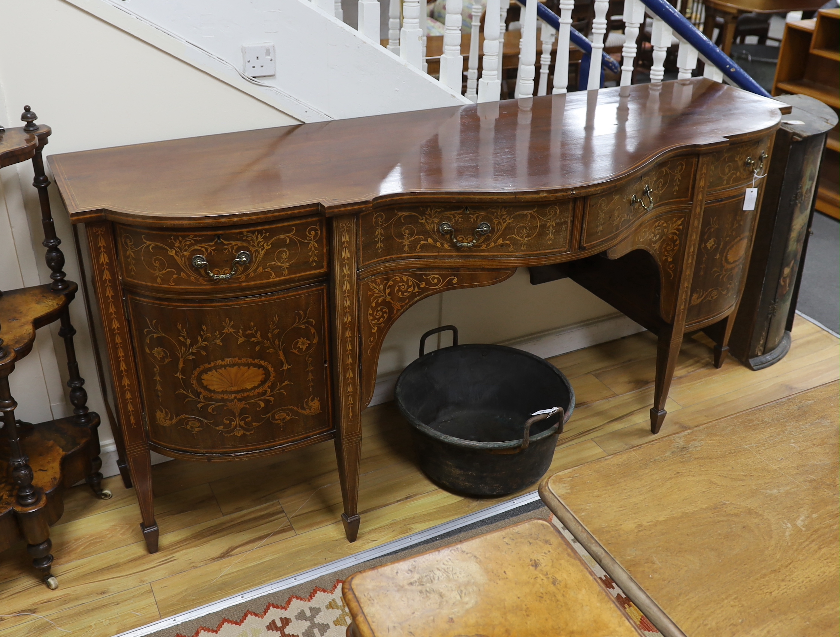 An Edwardian marquetry inlaid mahogany bow front sideboard, width 215cm, depth 73cm, height 95cm